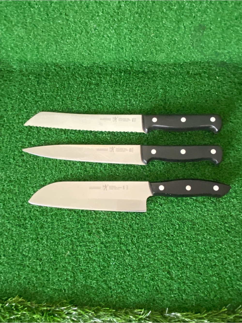 3-J.A. Henckels Knife
8”Bread Knife
7”Carving knife,
8”Gourmet Santoku knife
